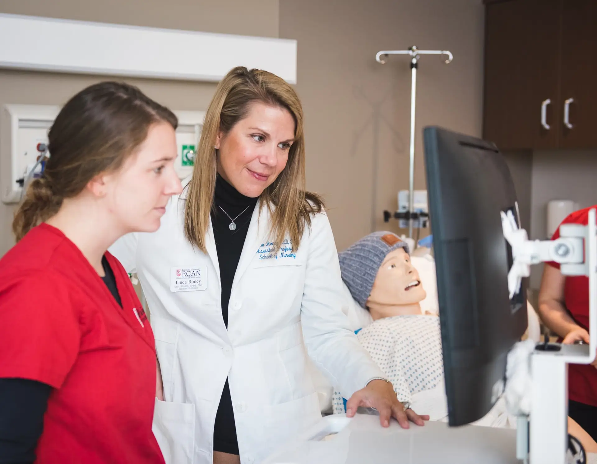 Egan school of Nursing students in Sim Lab Classroom with faculty